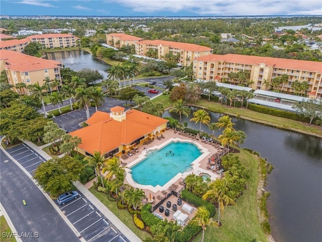 birds eye view of property with a water view