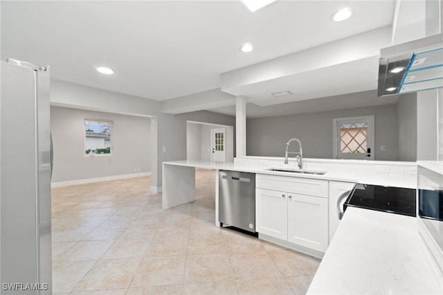 kitchen with white cabinetry, appliances with stainless steel finishes, sink, and light tile patterned floors