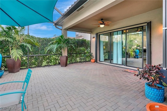 view of patio / terrace featuring ceiling fan