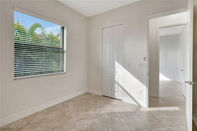 spare room with light tile patterned floors