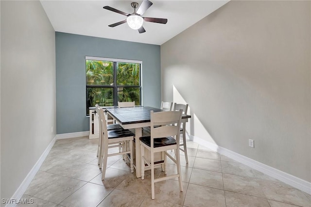 dining area with light tile patterned flooring and ceiling fan