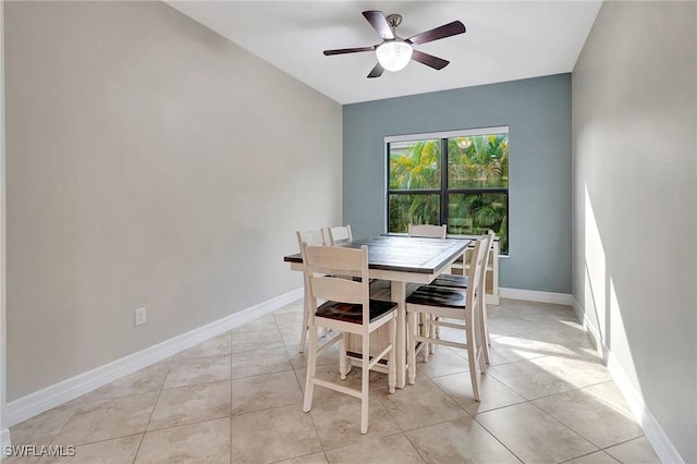 tiled dining area with ceiling fan