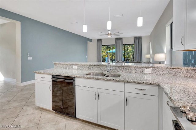 kitchen with light tile patterned flooring, sink, light stone counters, black dishwasher, and white cabinets