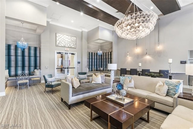 carpeted living room with a high ceiling, crown molding, and a chandelier