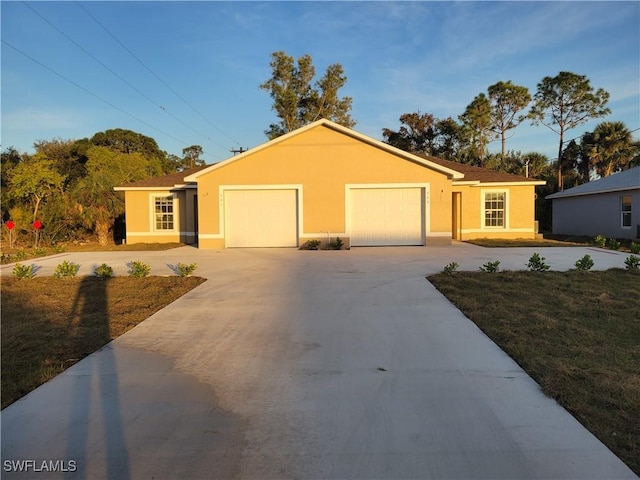 single story home featuring a garage