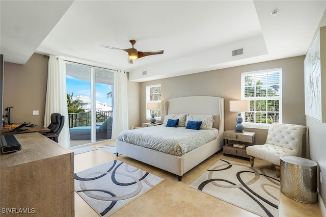 tiled bedroom with ceiling fan and access to outside