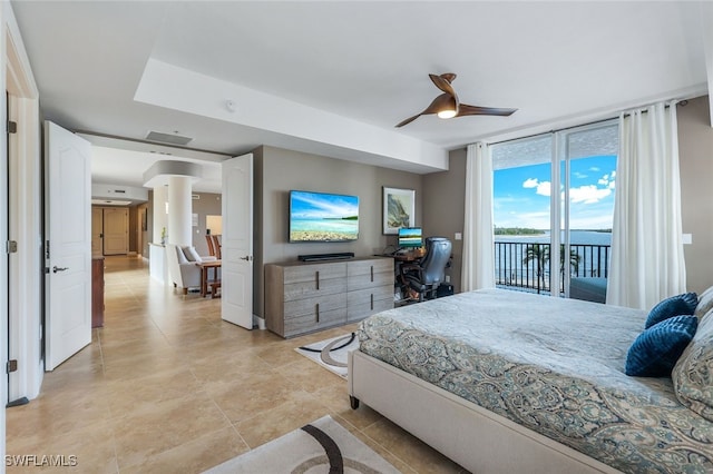 bedroom with ceiling fan, expansive windows, and access to outside