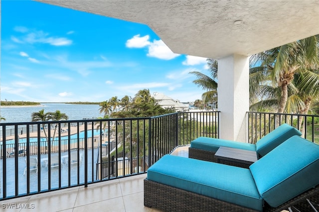 balcony featuring a water view