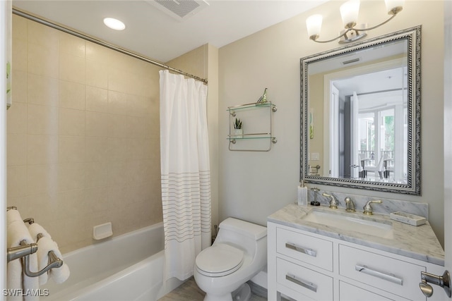 full bathroom with toilet, vanity, and shower / bath combo