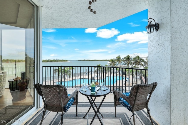 balcony featuring a water view