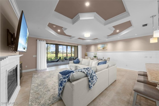 tiled living room featuring coffered ceiling and ornamental molding