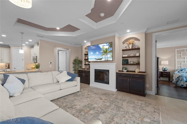 living room with crown molding, built in features, and light tile patterned flooring