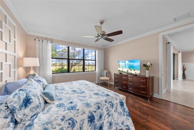 bedroom featuring dark hardwood / wood-style flooring, crown molding, and ceiling fan