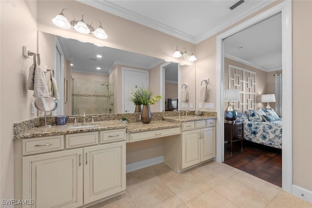 bathroom with ornamental molding, vanity, and tile patterned floors