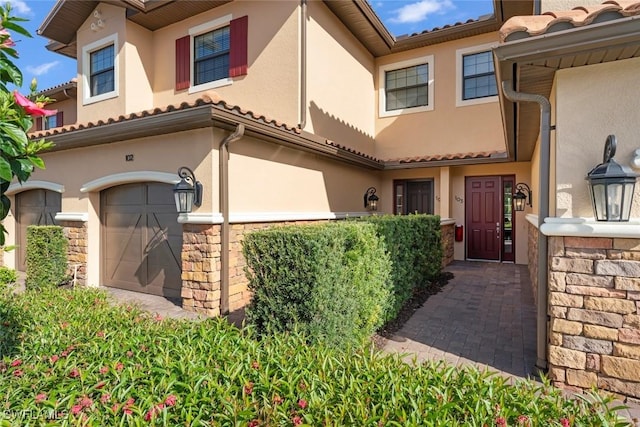 entrance to property featuring a garage