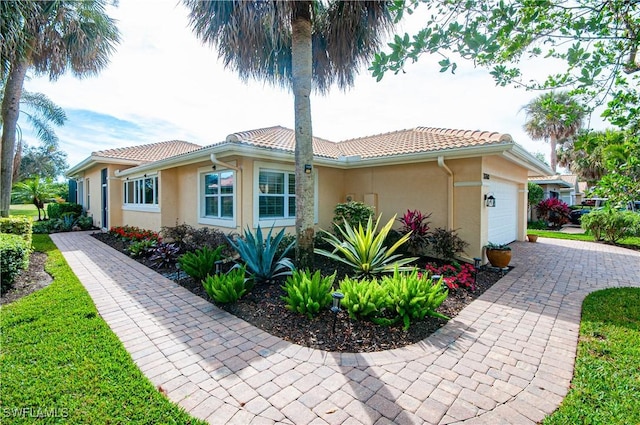 view of side of home featuring a garage