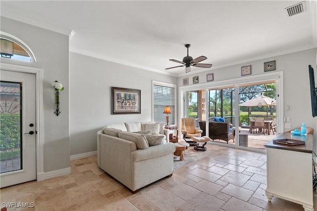 living room featuring ceiling fan and ornamental molding