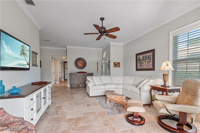 living room with ceiling fan and ornamental molding