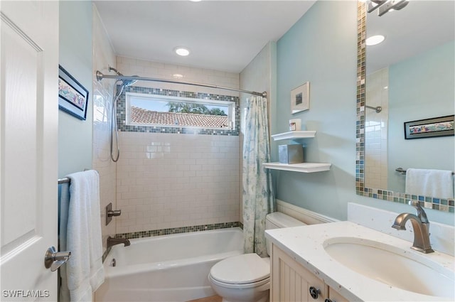 full bathroom featuring toilet, vanity, and shower / tub combo