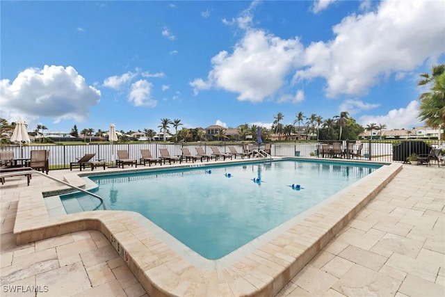 view of swimming pool with a patio