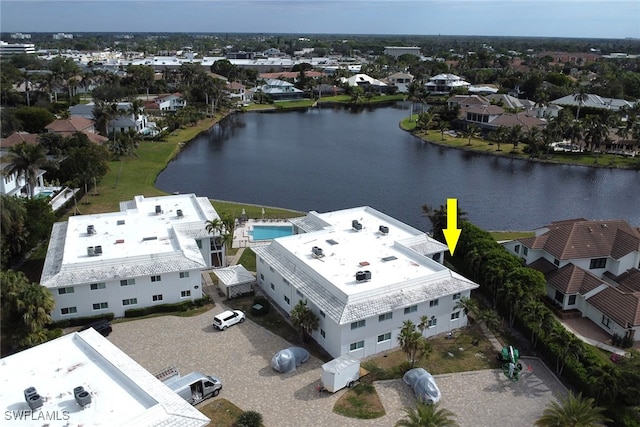 birds eye view of property with a water view