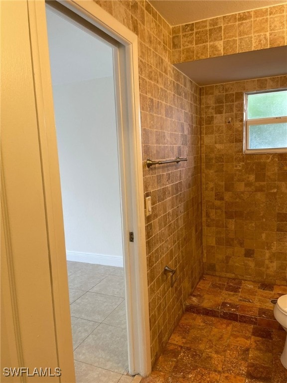 bathroom featuring toilet and a shower