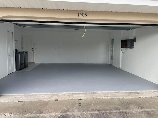 garage with washing machine and dryer