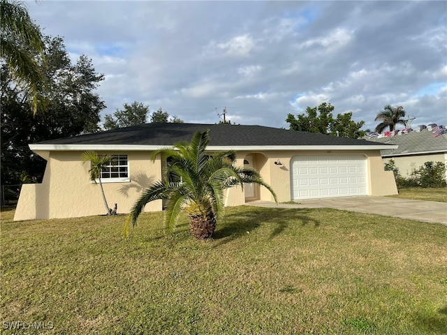 ranch-style house featuring a garage and a front lawn