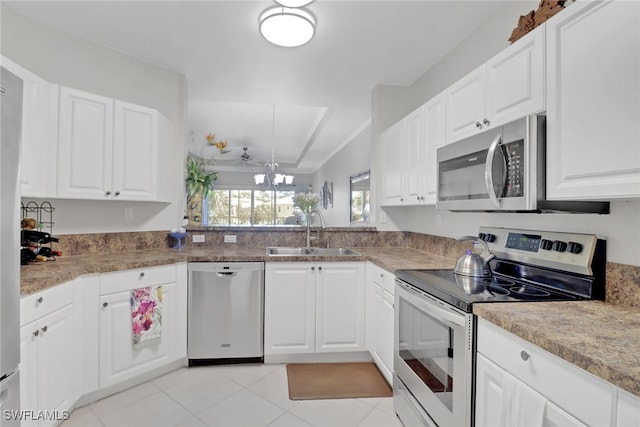 kitchen with sink, stainless steel appliances, and white cabinets