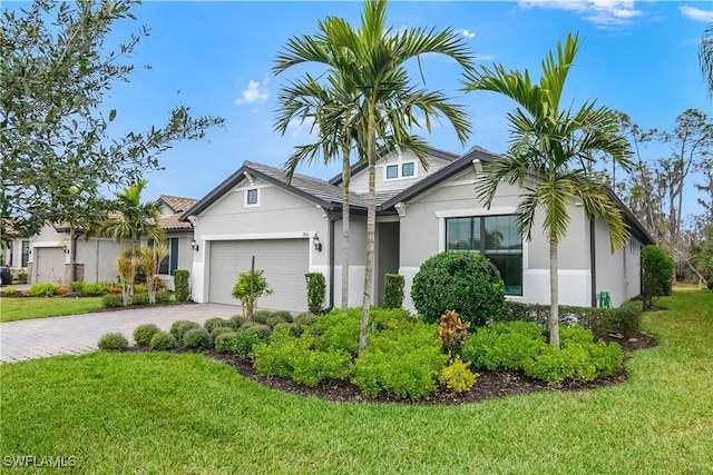 view of front facade featuring a front yard and a garage