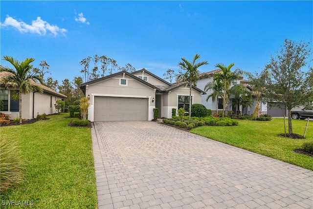 ranch-style home with a garage and a front lawn