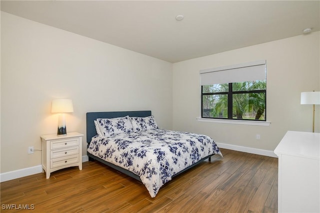 bedroom featuring dark hardwood / wood-style flooring