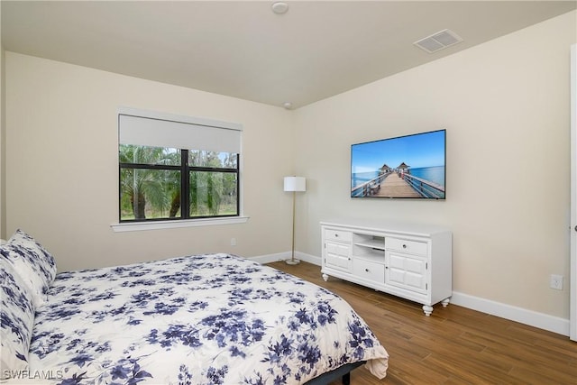 bedroom featuring dark hardwood / wood-style floors