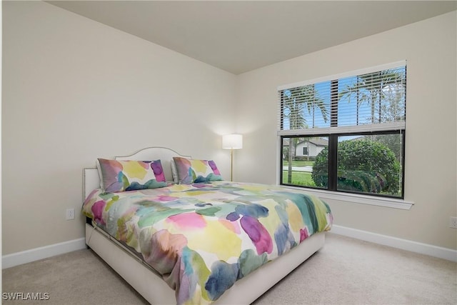 bedroom with light colored carpet