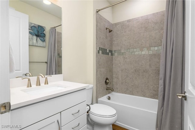 full bathroom with toilet, vanity, and shower / tub combo with curtain