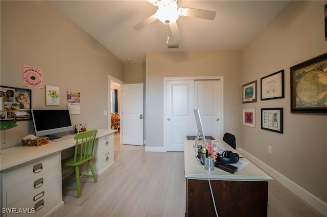 home office with ceiling fan and light hardwood / wood-style floors