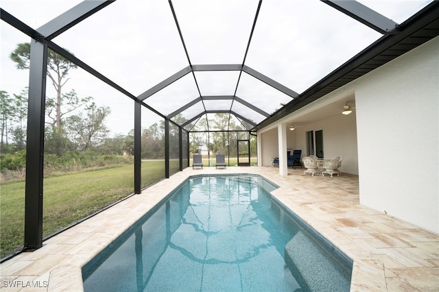 view of pool with a patio area, a lanai, and a lawn