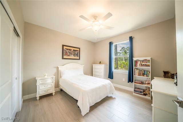 5435 Montego Ln, Port Charlotte, FL 33981 - bedroom featuring a closet, baseboards, light wood finished floors, and a ceiling fan