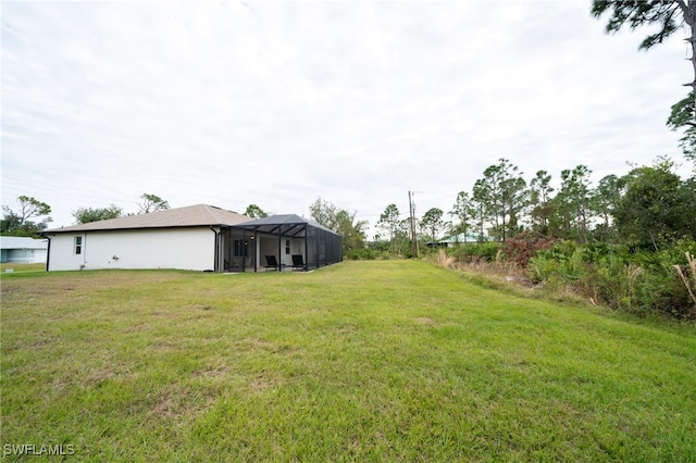 5435 Montego Ln, Port Charlotte, FL 33981 - view of grassy yard featuring glass enclosure