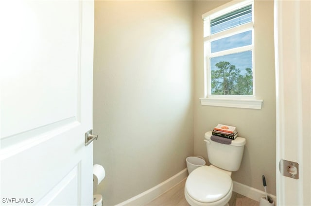 5435 Montego Ln, Port Charlotte, FL 33981 - bathroom with toilet and baseboards