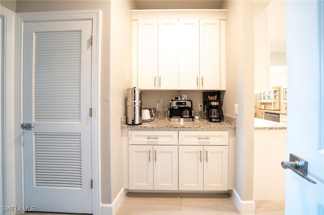 5435 Montego Ln, Port Charlotte, FL 33981 - bar area featuring baseboards, dishwasher, and light wood-style floors