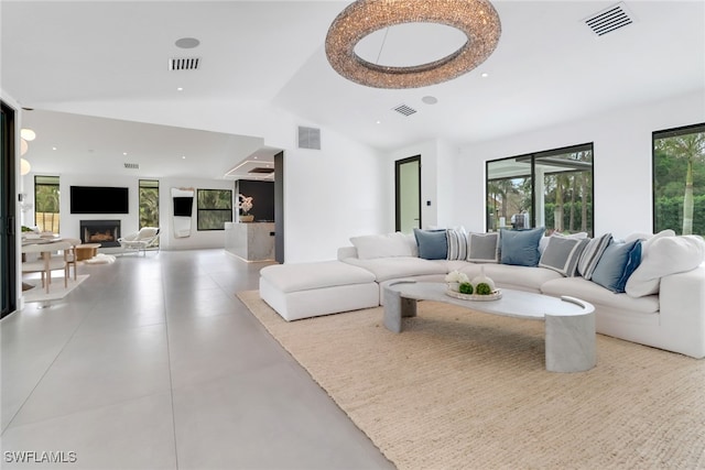 living room featuring a fireplace and visible vents