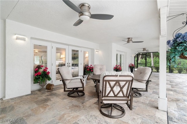 view of patio / terrace with ceiling fan and french doors