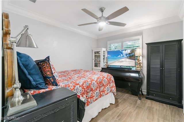 bedroom featuring ceiling fan and ornamental molding