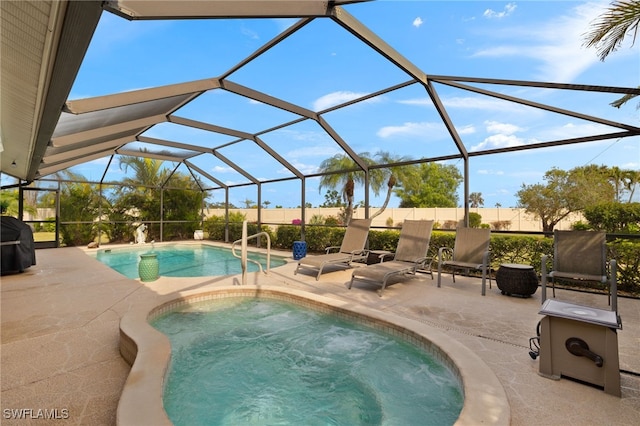 view of swimming pool featuring a grill, a lanai, and a patio