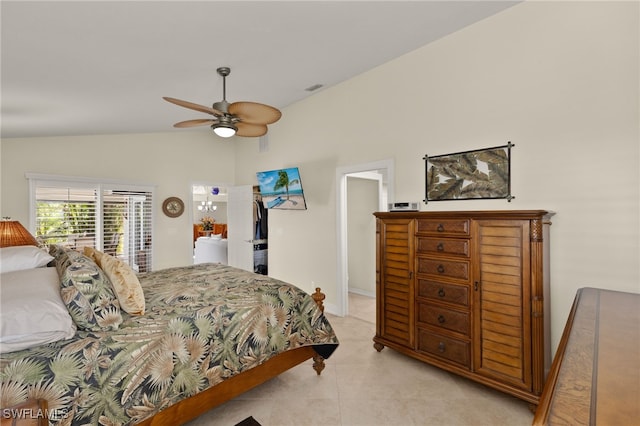 bedroom with ceiling fan, light tile patterned floors, visible vents, baseboards, and vaulted ceiling