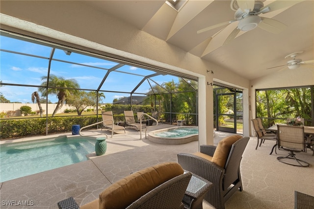 outdoor pool with a patio area, ceiling fan, and glass enclosure