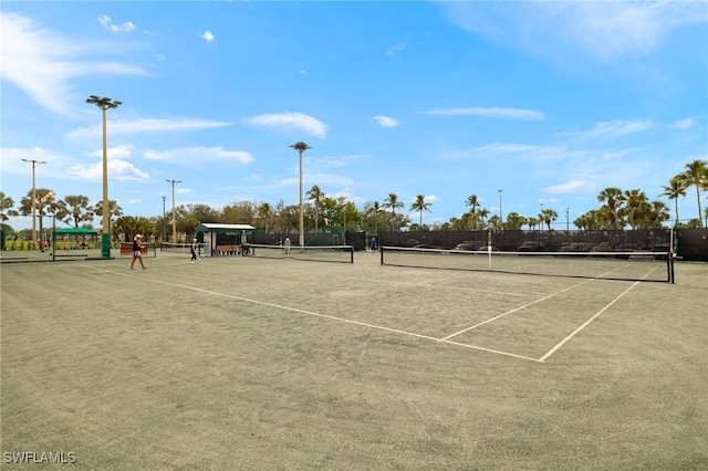 view of sport court with fence