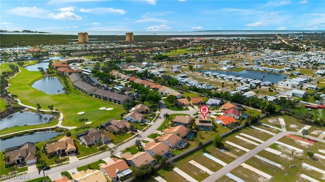 aerial view featuring a water view, a residential view, and golf course view