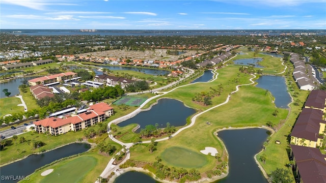 birds eye view of property featuring golf course view, a water view, and a residential view